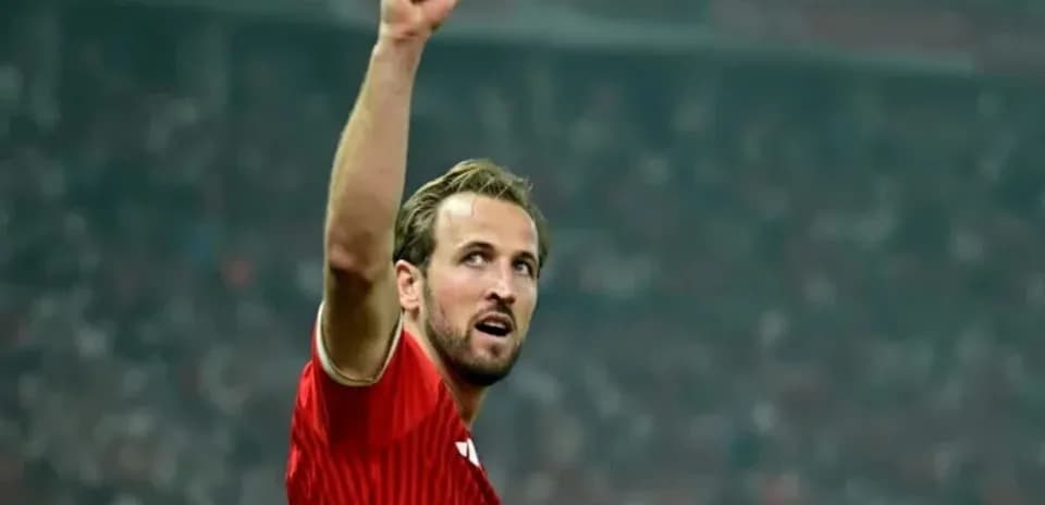 Player celebrating with raised fist in stadium