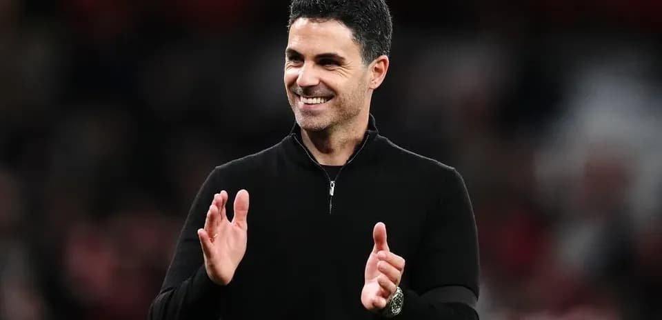 Manager applauding during match at stadium