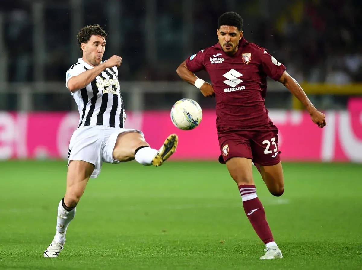 Player kicking the ball in Torino vs Juventus match