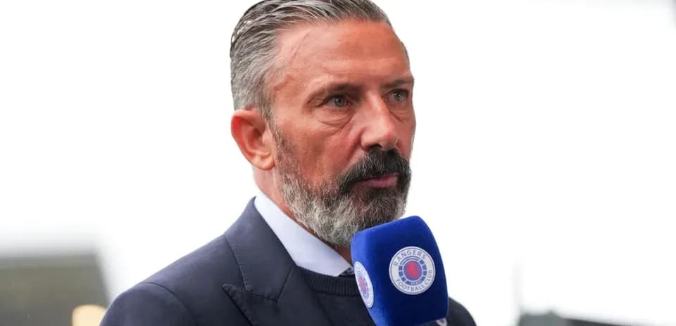 Man speaking into microphone at event