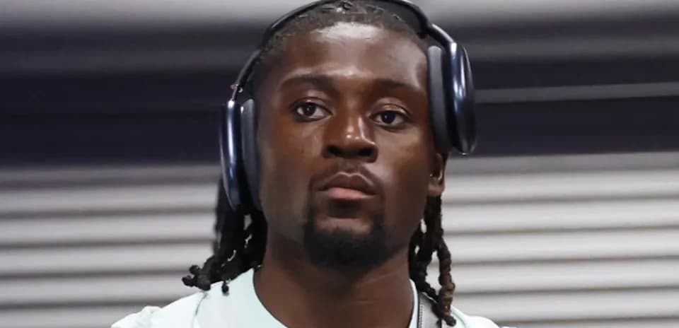 Player wearing headphones before a match