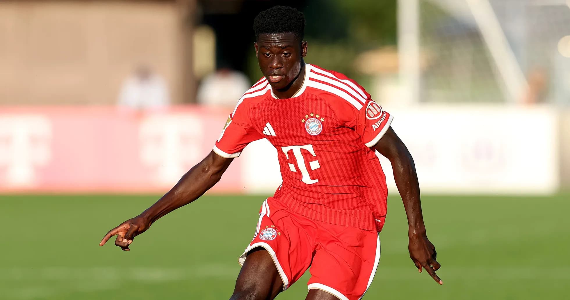 Player in red Bayern Munich jersey during match