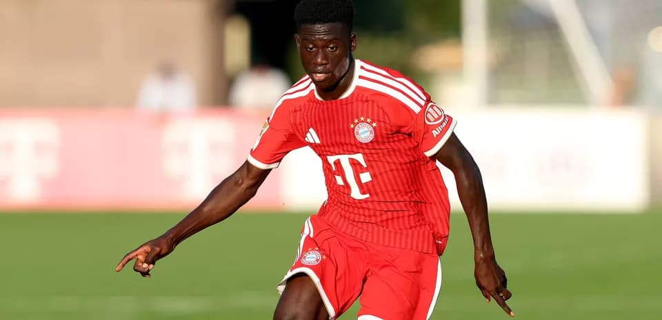 Player in red Bayern Munich jersey during match