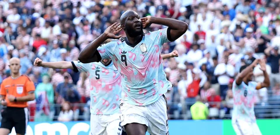 Player celebrating goal with fans during match