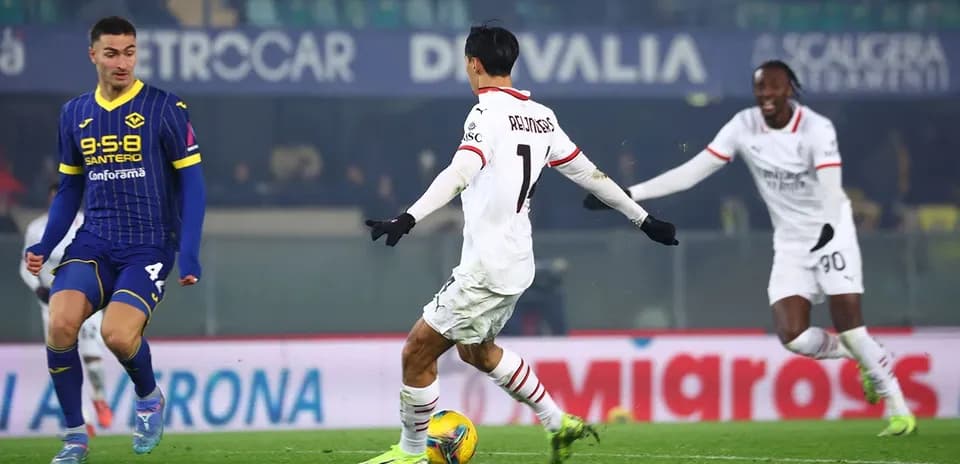 Hellas Verona and AC Milan players in action