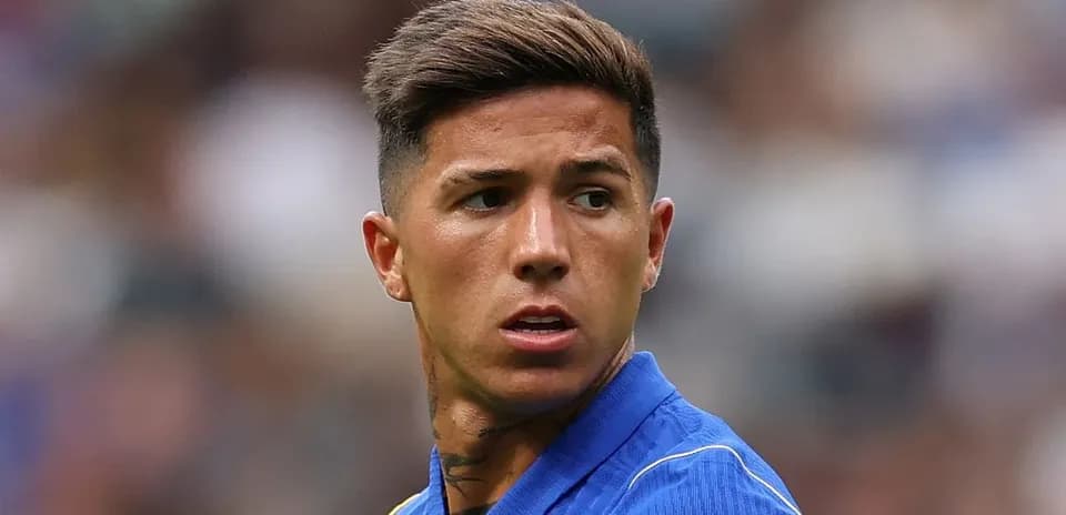 Player in blue jersey looking towards the field