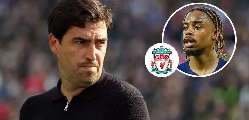 Coach looking on with Liverpool FC logo and player image