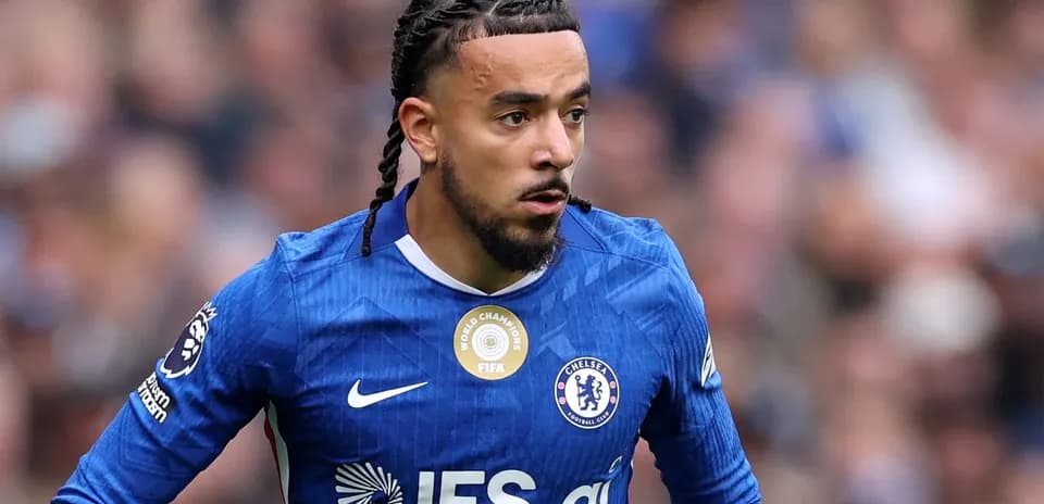 Player in Chelsea kit running during match