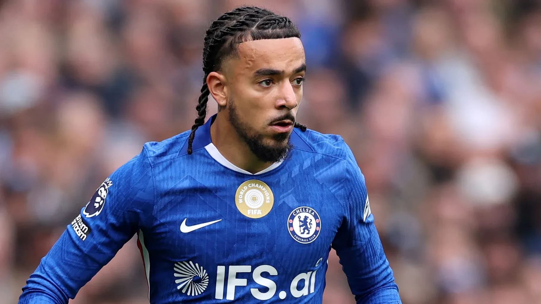 Player in Chelsea kit running during match