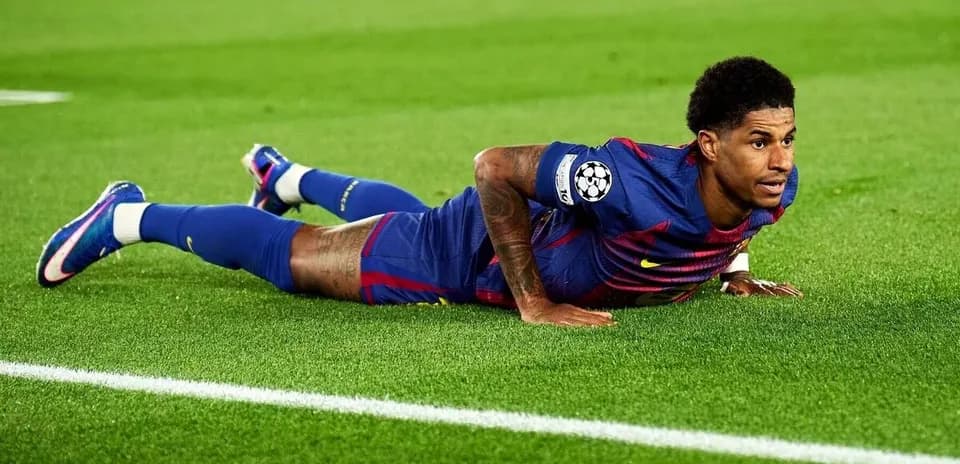 Player lying on the pitch during a match