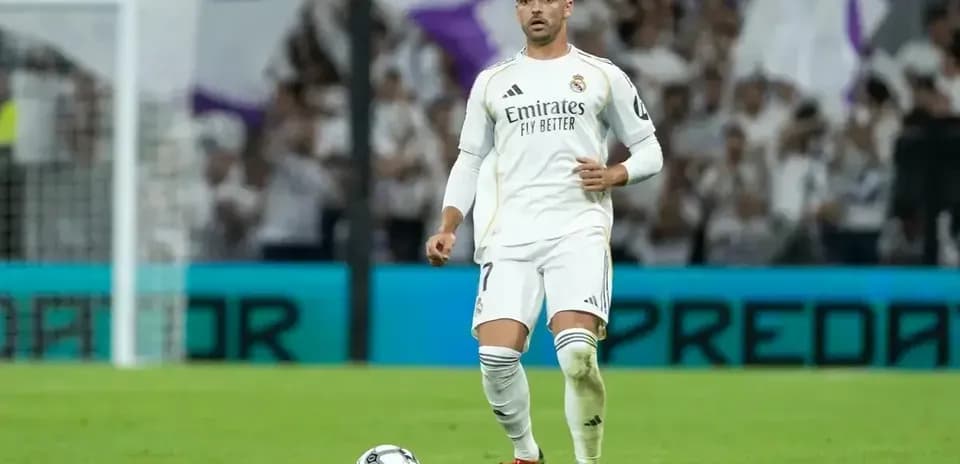 Player preparing to take a free kick on field