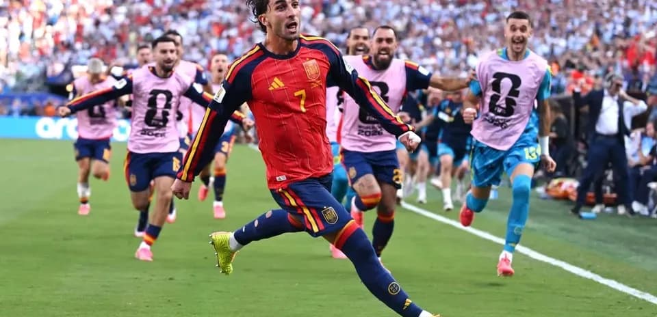 Spain player celebrating a goal with teammates