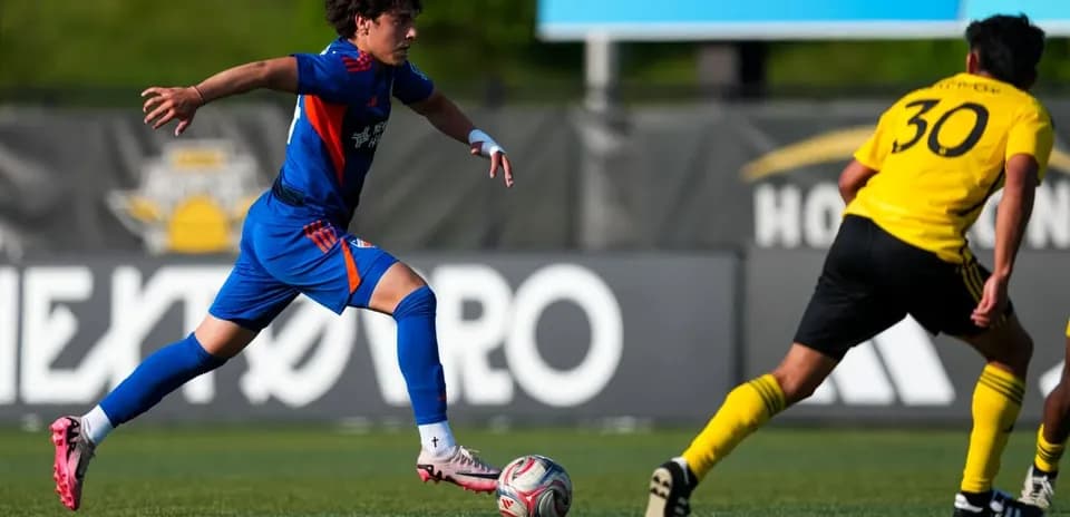 FC Cincinnati II player dribbling against Columbus Crew II