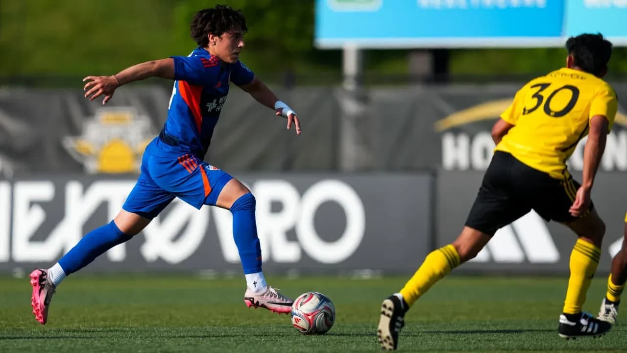 FC Cincinnati II player dribbling against Columbus Crew II