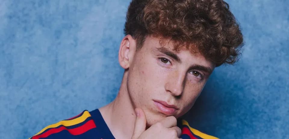 Young person posing with hand on chin