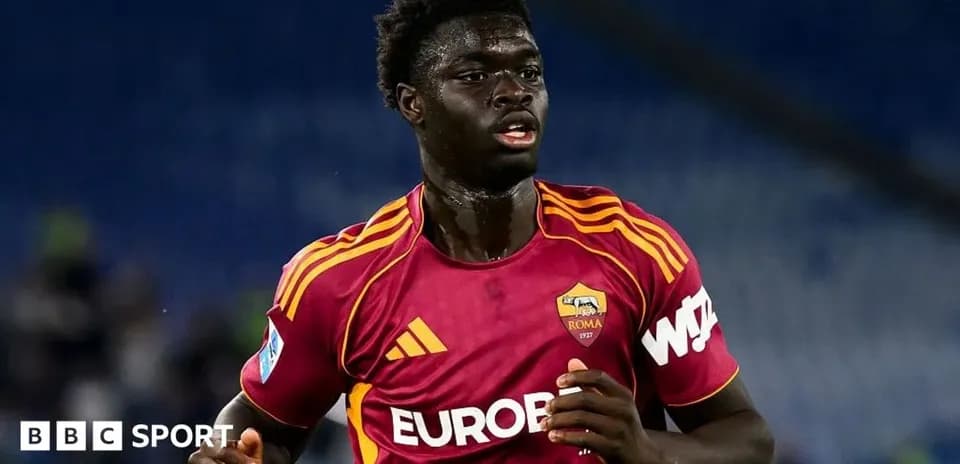 Player running in AS Roma kit during match