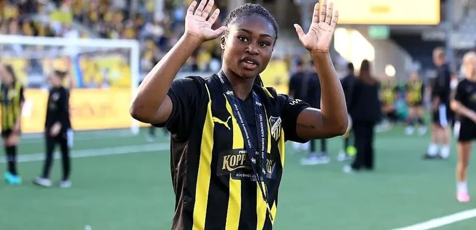 Player waving on the field after the match
