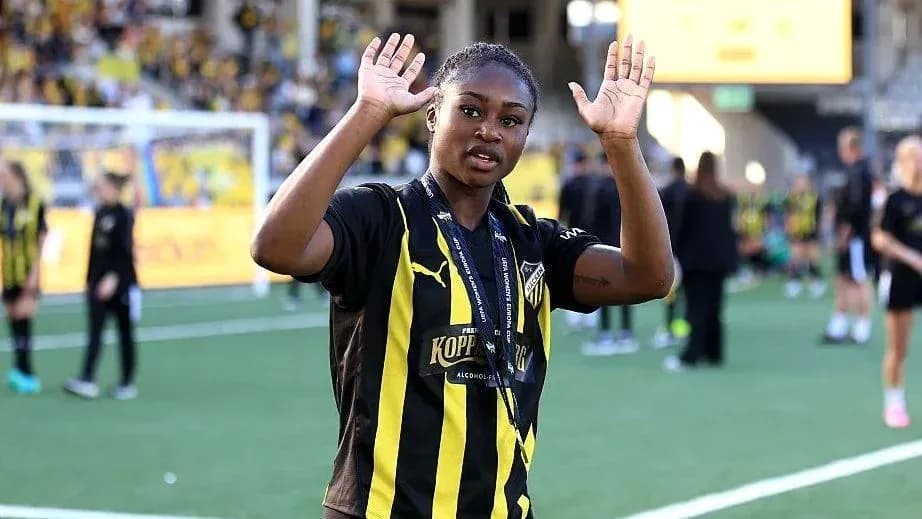 Player waving on the field after the match
