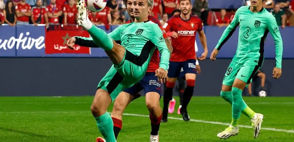 Atletico Madrid player kicking ball against Osasuna