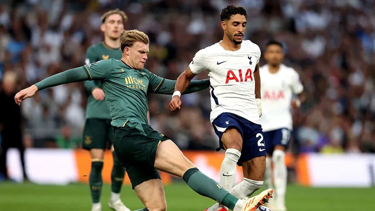 Player tackling opponent during football match action