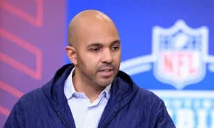 Speaker at NFL event discussing player prospects