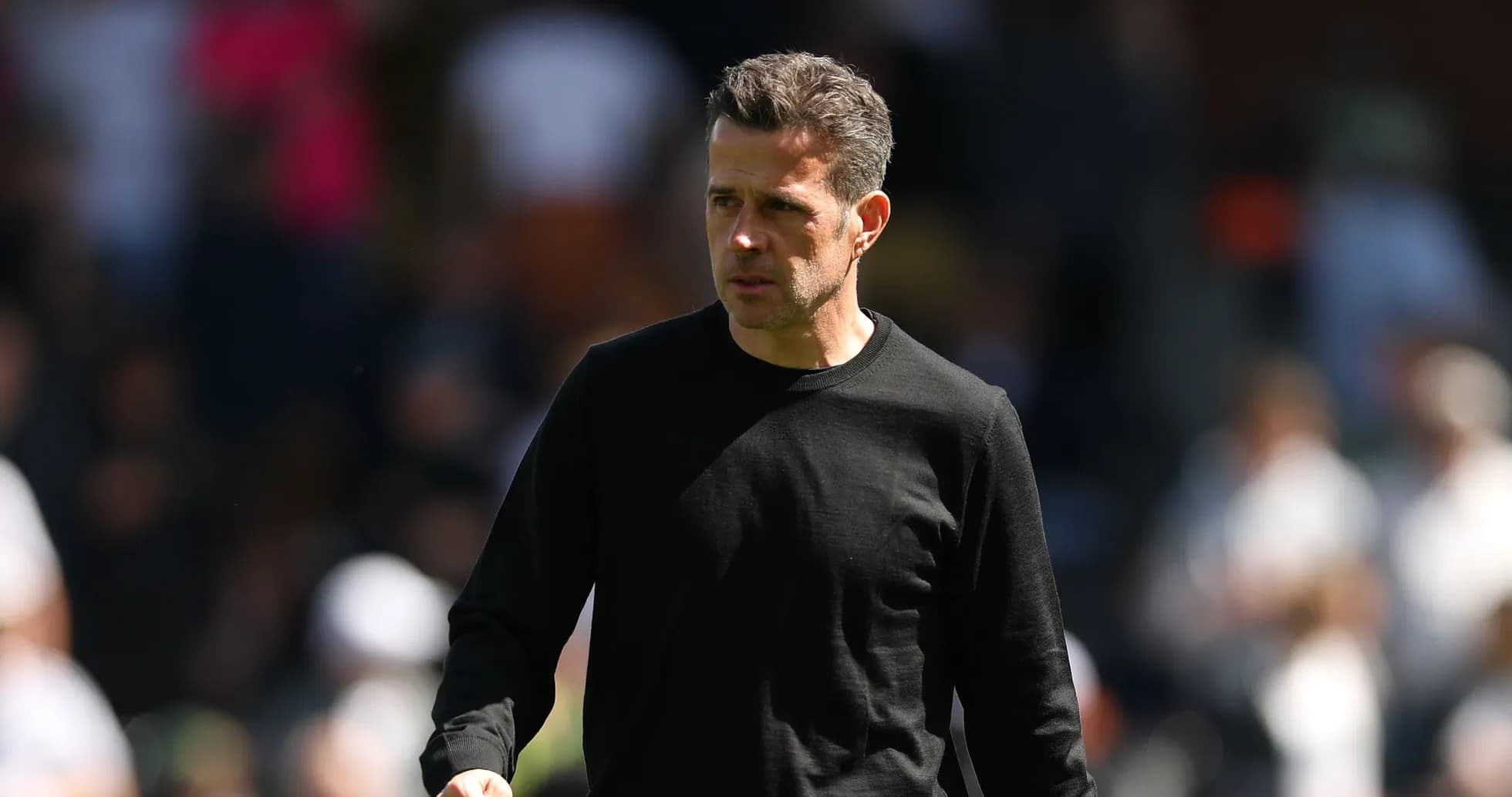 Coach walking on the sidelines during match