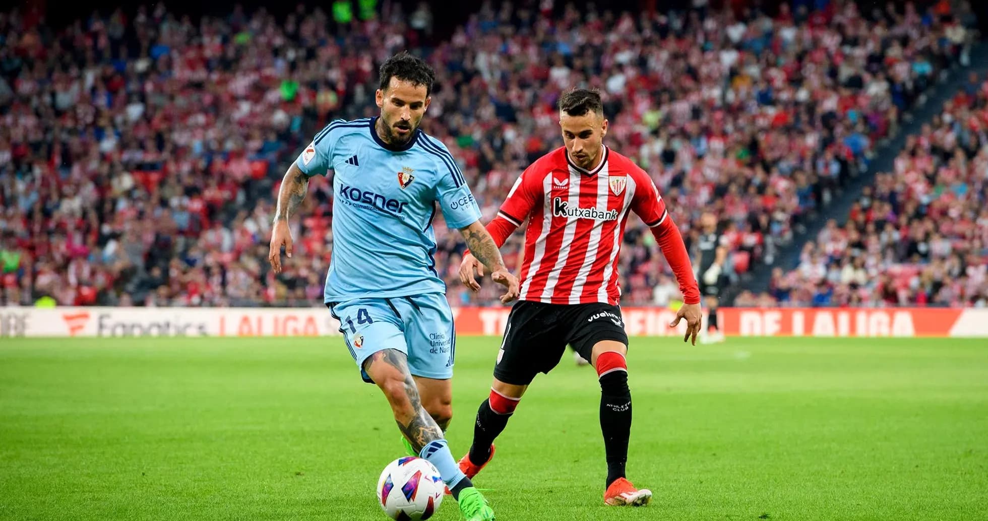 Two players competing for the ball in La Liga