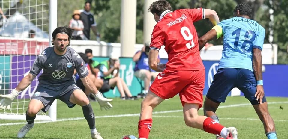 Player attempting to score against goalkeeper
