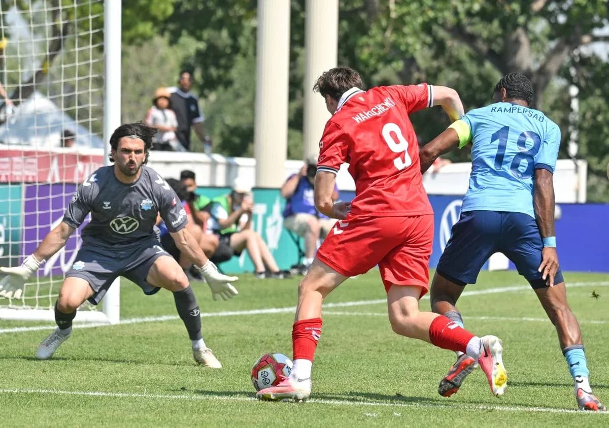 Player attempting to score against goalkeeper