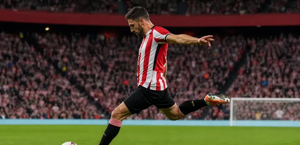 Player kicking the ball during a match
