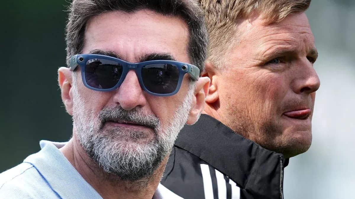 Two coaches observing training session outdoors