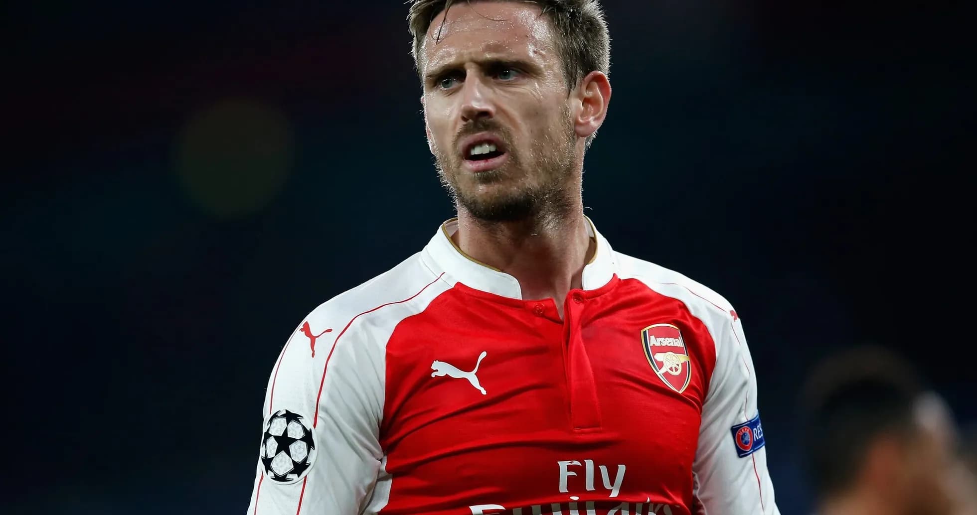 Player in Arsenal jersey during match action