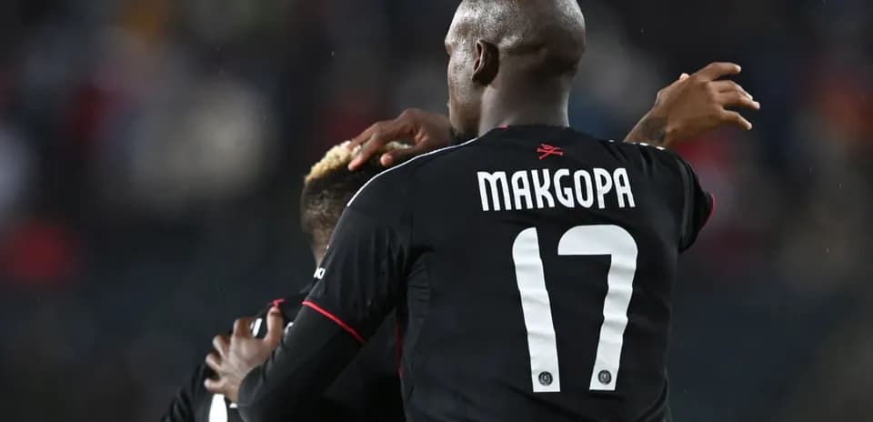 Players celebrating during a football match