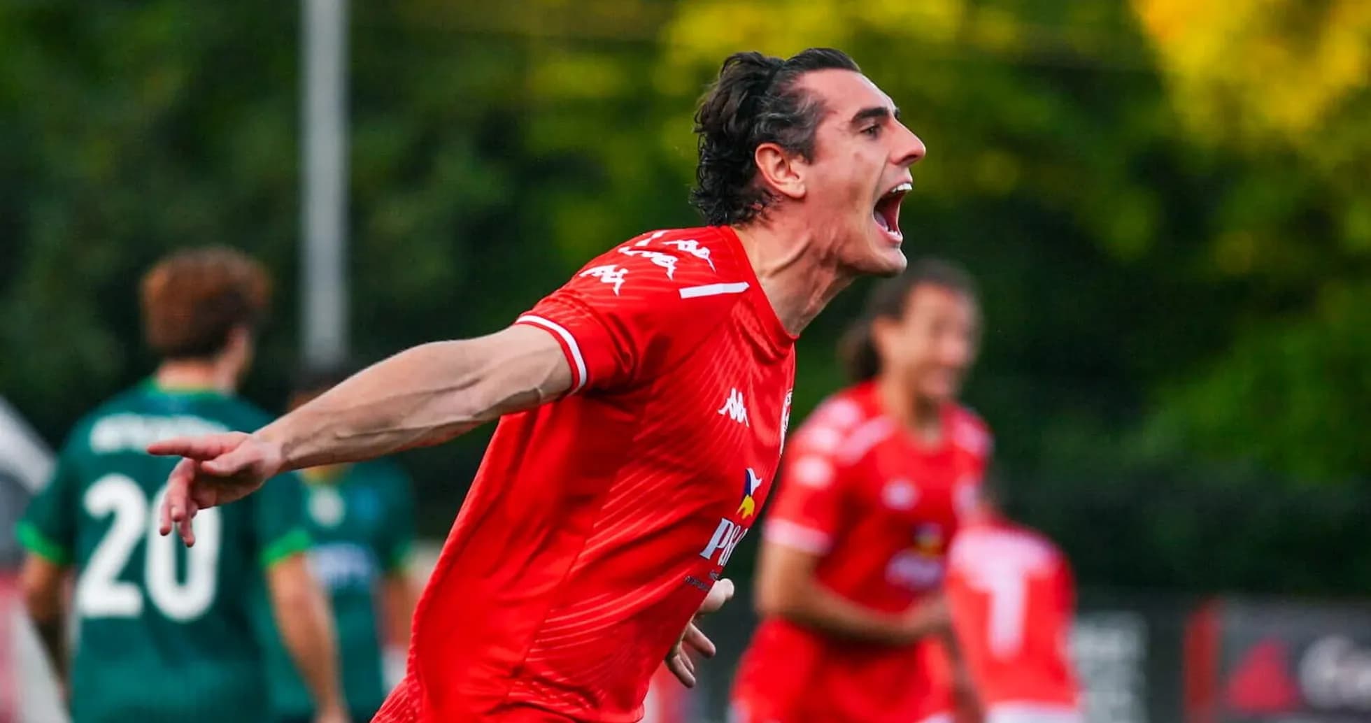 Player celebrating goal during Larne match