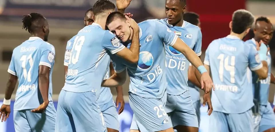 Players celebrating goal in U23 football match