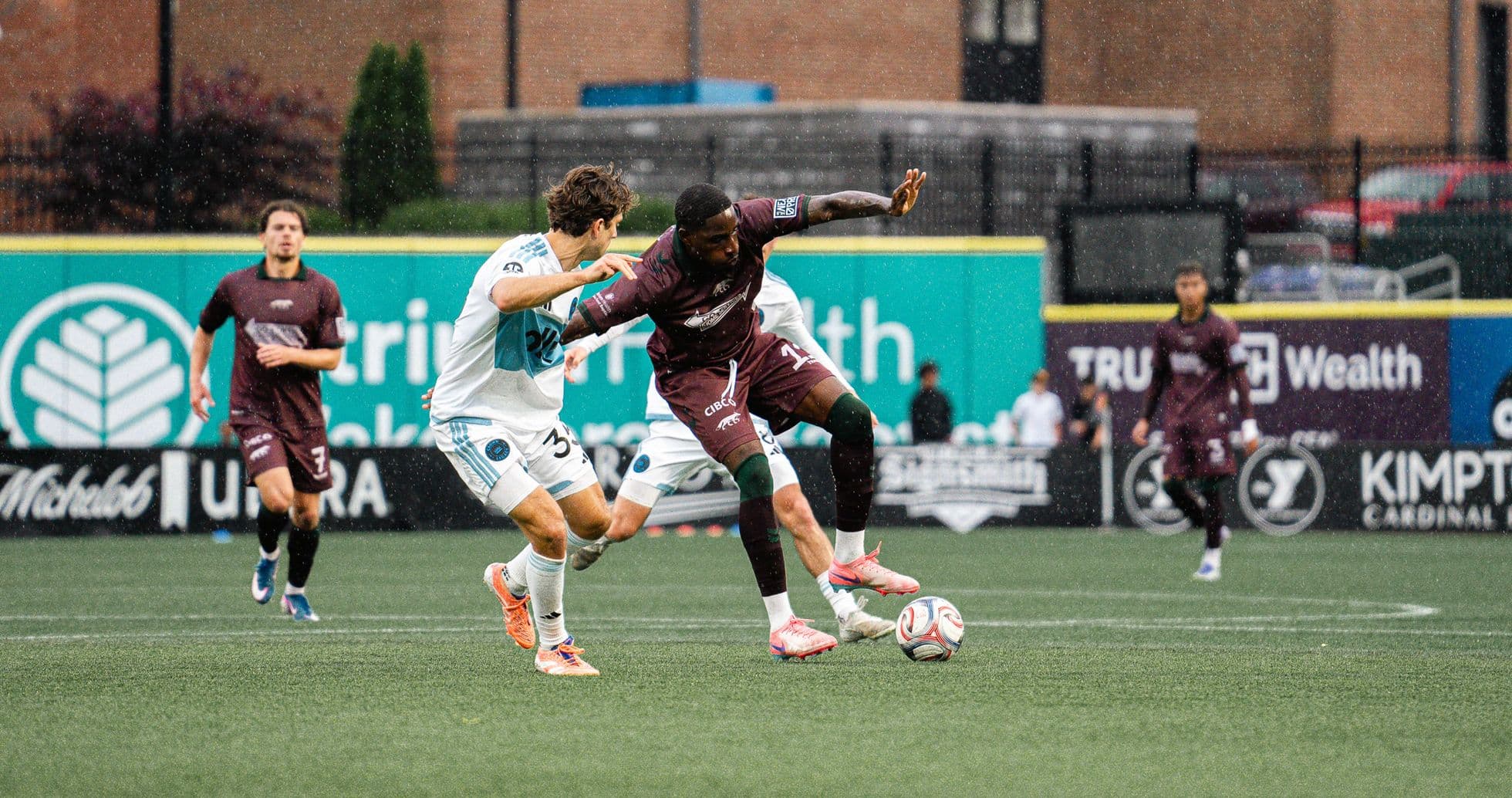 Player tackling opponent during Carolina Core match
