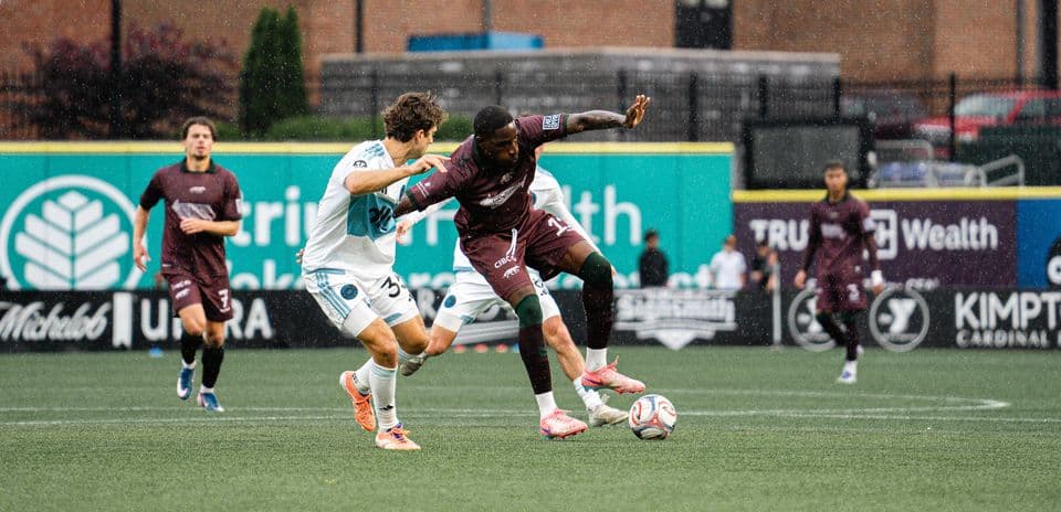 Player tackling opponent during Carolina Core match