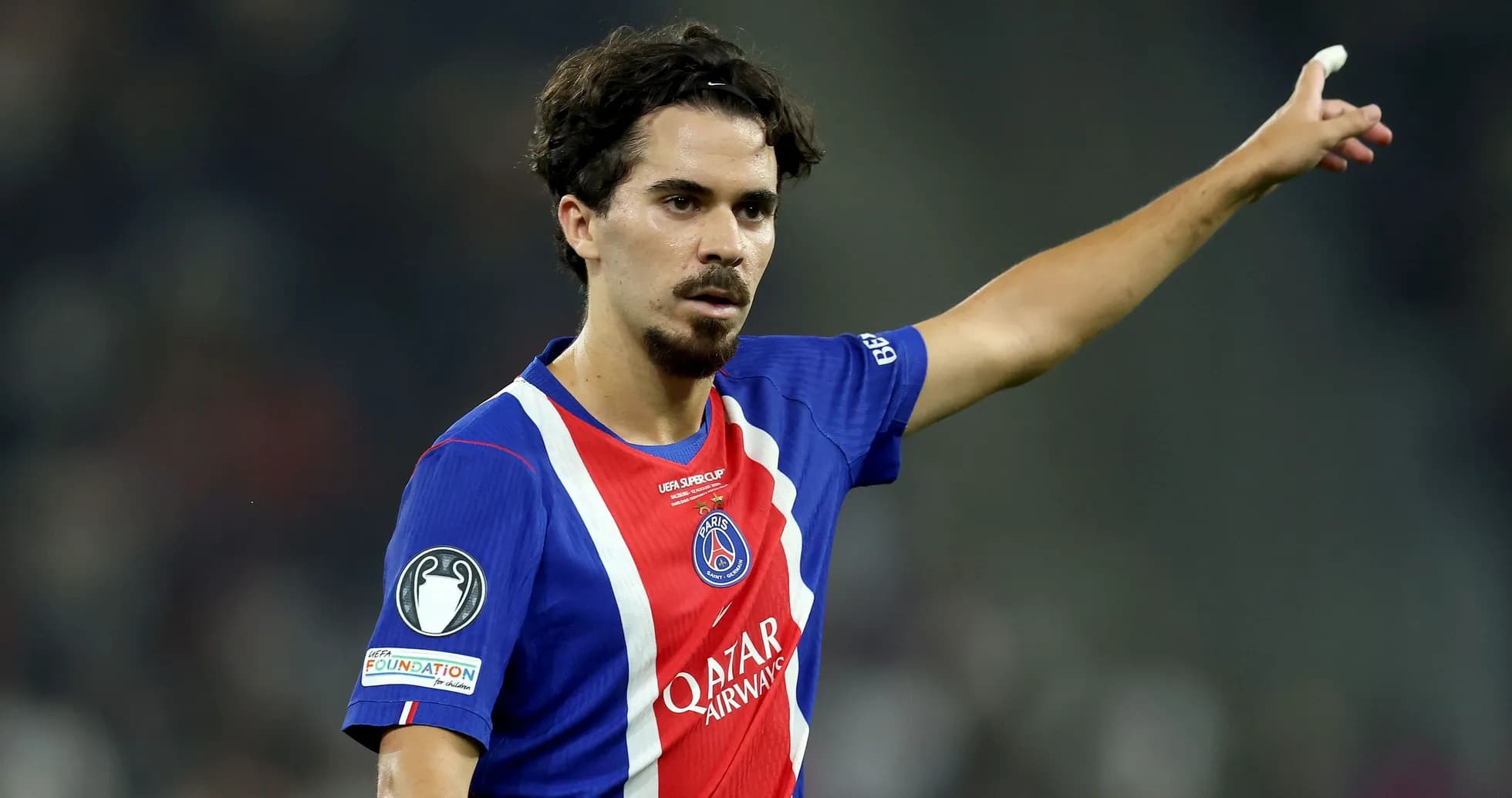 Player gesturing during match in PSG jersey