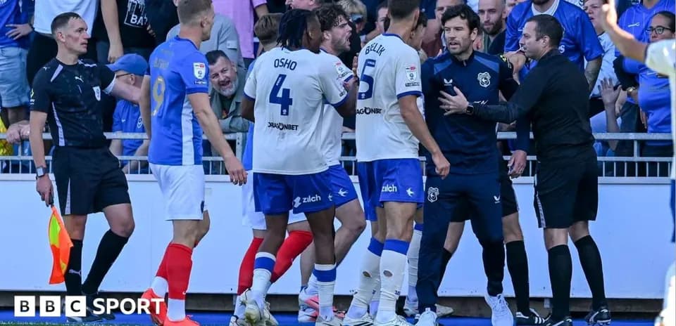 Players and officials arguing during a match