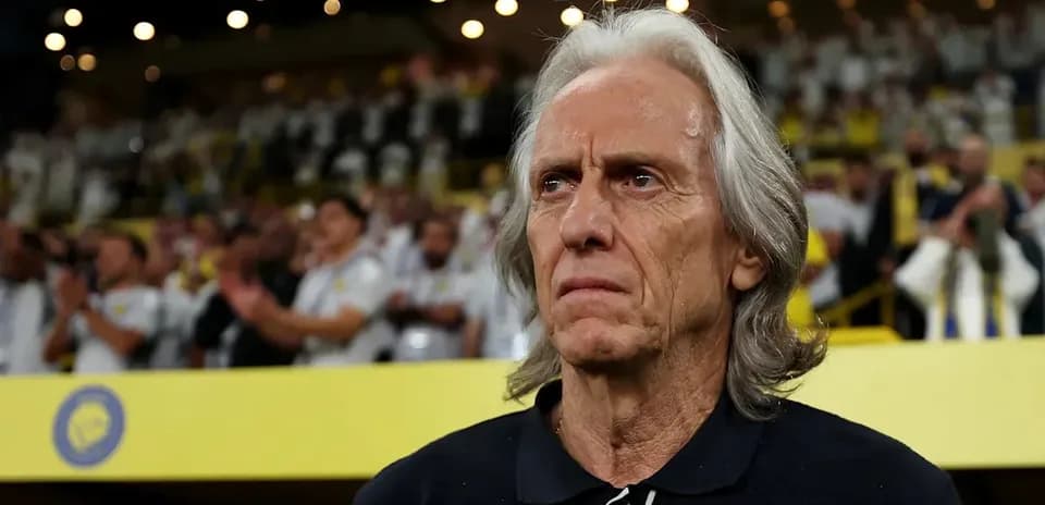 Coach observing fans during a match in stadium