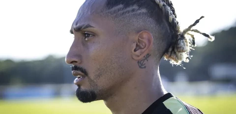 Profile view of a football player in training