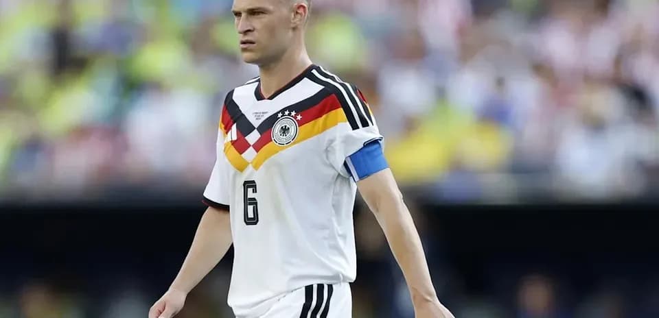 Player in Germany kit walking on the pitch