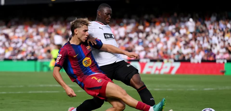 Barcelona player tackled by opponent during match