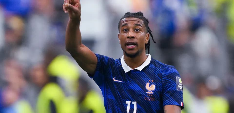 Player gesturing during football match for France