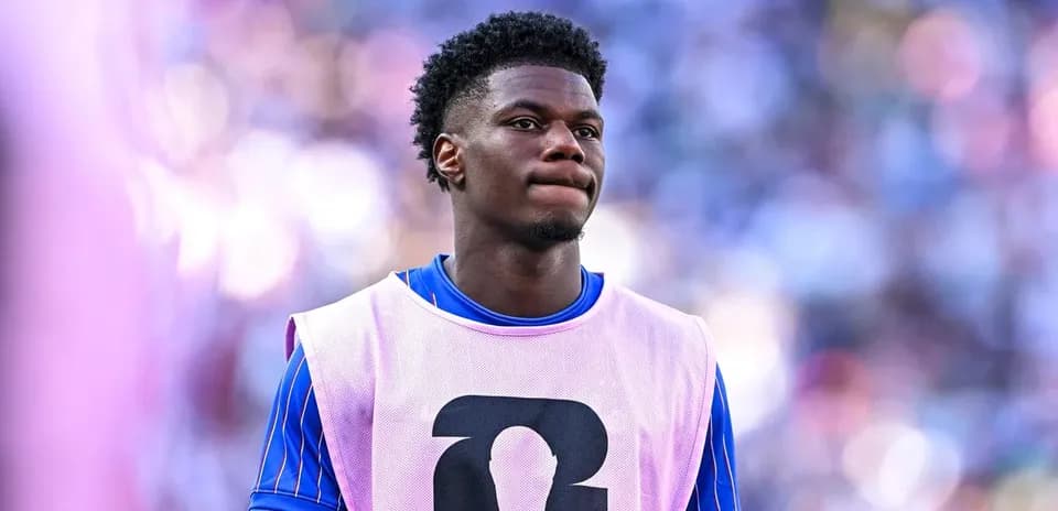 Player in warm-up gear on sidelines during match