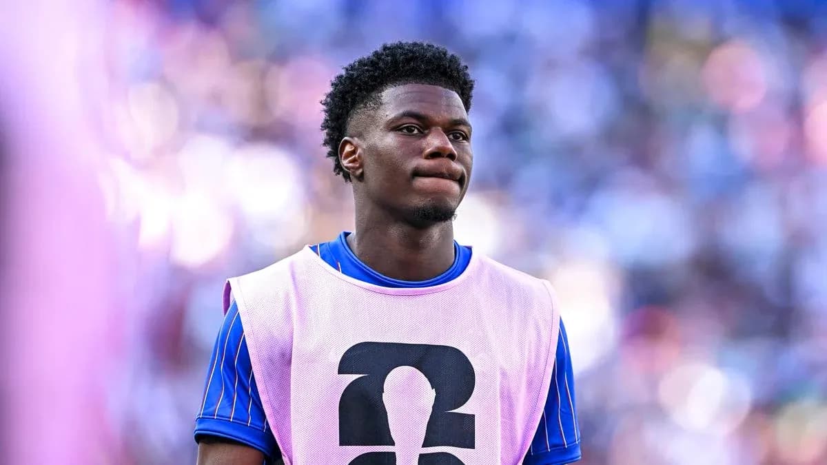 Player in warm-up gear on sidelines during match