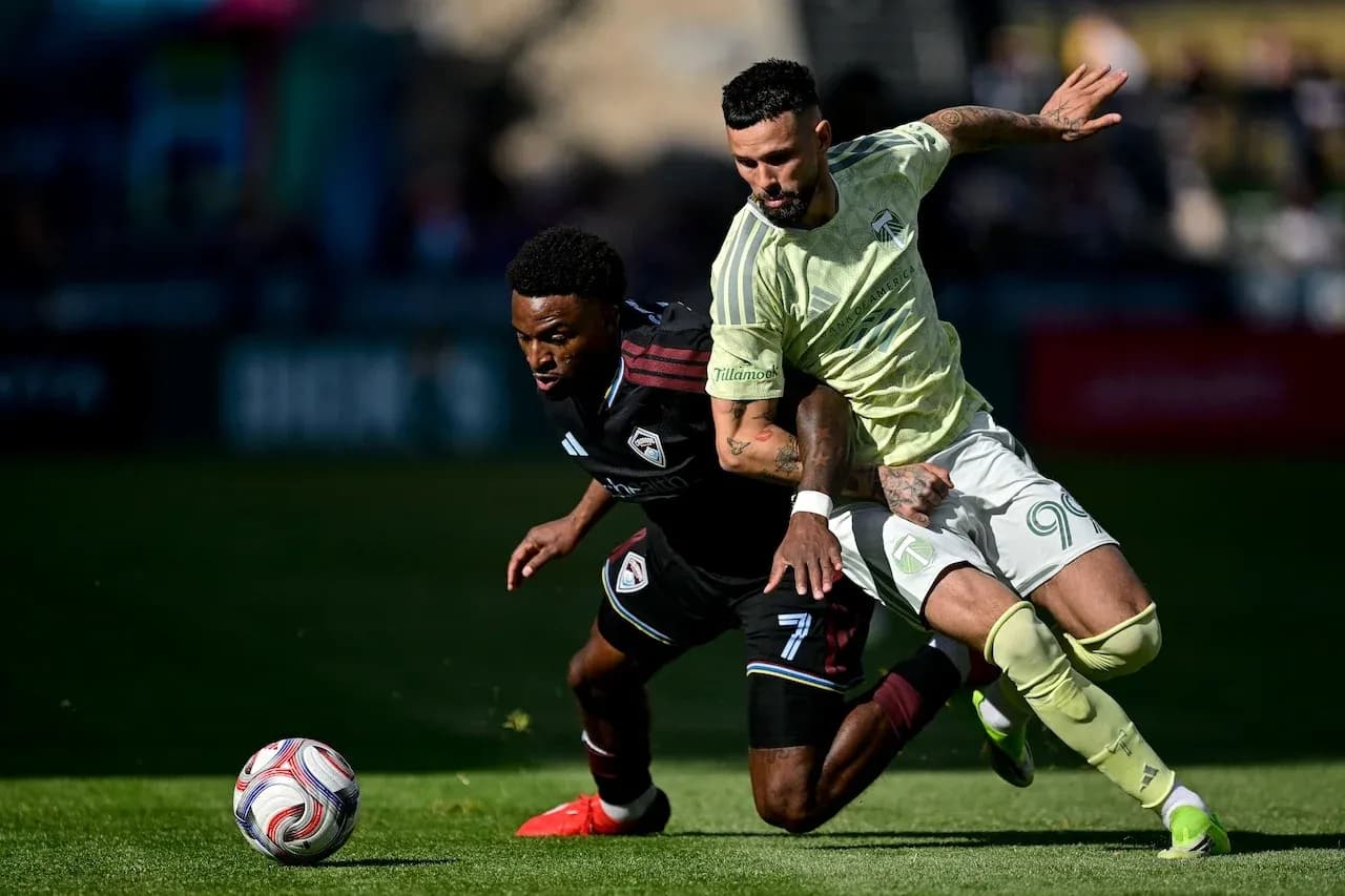 Players competing for the ball in MLS Next Pro