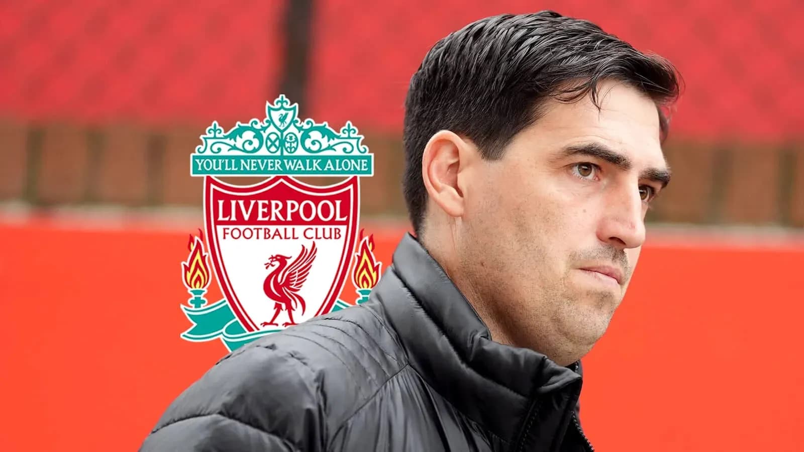 Manager standing near Liverpool FC logo background