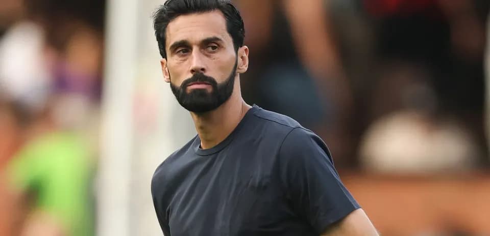 Player in black shirt observing the match