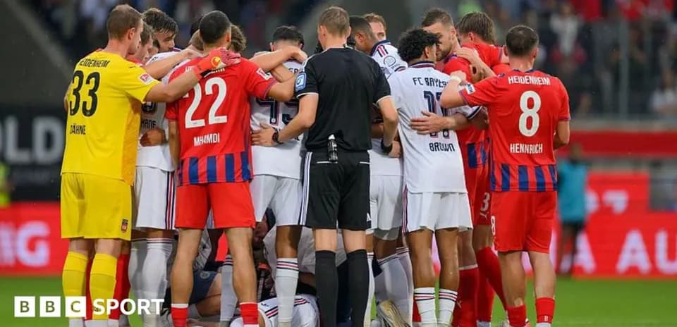 Players from both teams gathered around an injured player
